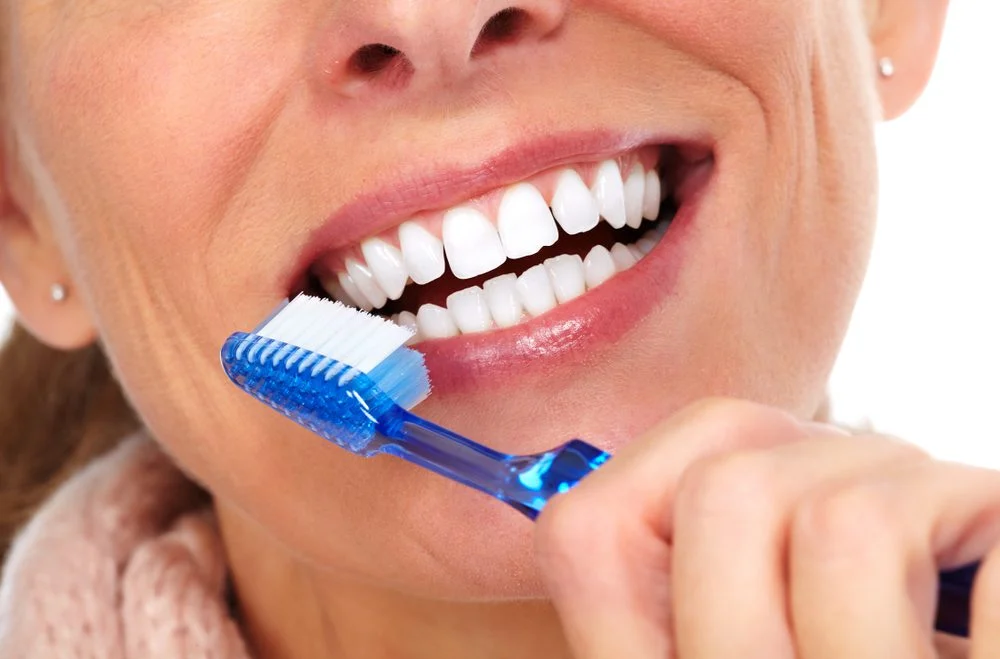 Woman Brushing teeth